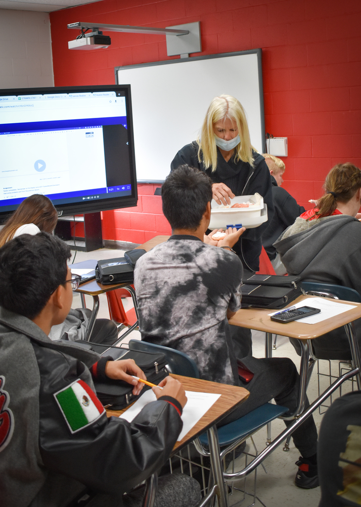 Mrs. Cormack hands out her famous Cormack Cookies to all the students to celebrate Halloween.