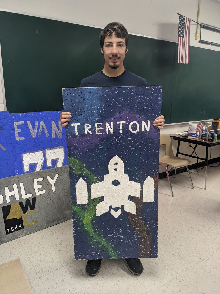 Trenton's ceiling tile has a space ship on it.
