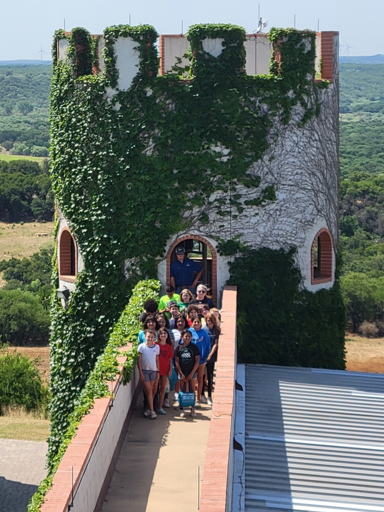 Fourth and Fifth grade group photo in front of ivy-covered castle